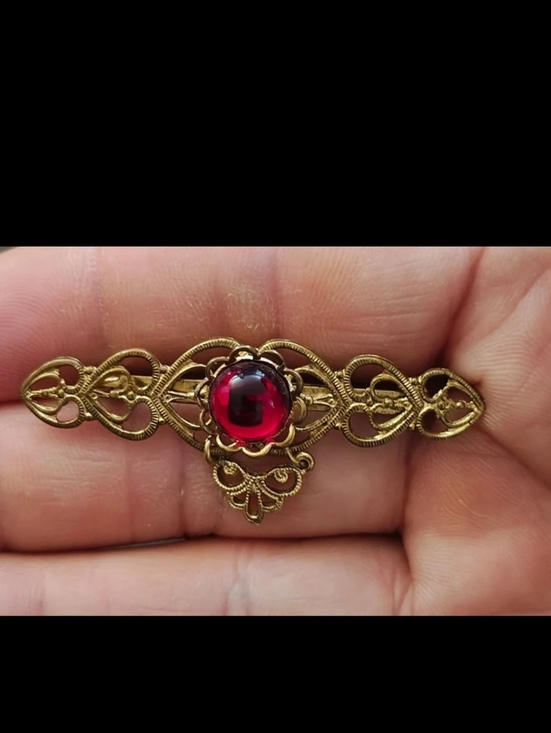 Unique Vintage Jewelry - 1960s/70s Goldtone Open Sideways Hearts  With Center Red Jelly Cabochon Brooch